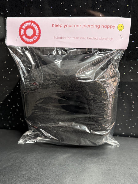 The Happy Piercing cushion